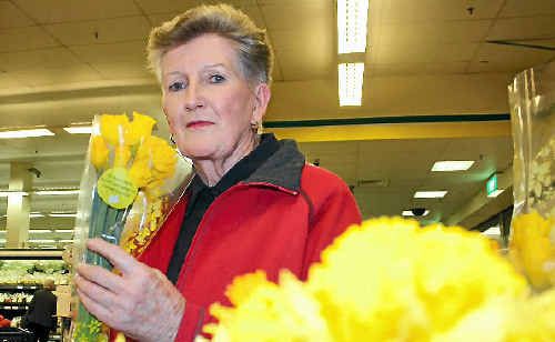 Cancer survivor Erin Kelly checks out daffodils for sale. Cancer survivor Erin Kelly checks out daffodils for sale.